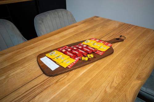 a toy train is sitting on a wooden table at Apartment Aveline in Bjelašnica