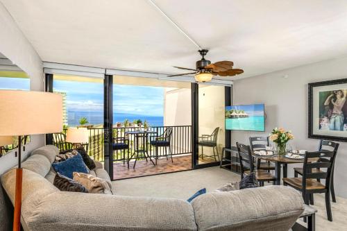 a living room with a couch and a table at Napili Point by KBM Resorts in Kaanapali