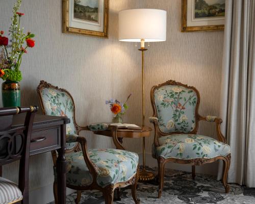 a room with two chairs and a lamp and a desk at Rosemead House in Victoria