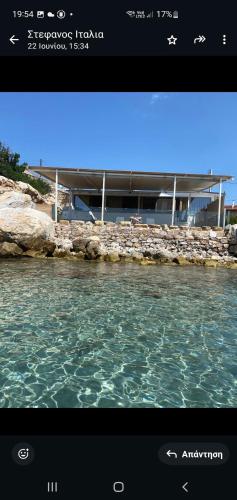 a television screen with a picture of the water at AQUA VILLA in Selínia