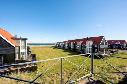 a row of houses in a field with grass at 40143-Juelsminde-Strandengen-75 in Juelsminde