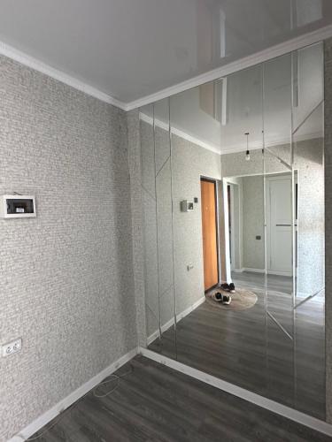 an empty room with a glass shower in it at Сдаётся просторная двухкомнатная квартира in Balykchy