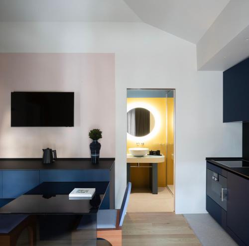 a bathroom with a sink and a mirror at Interno Marche Design Experience Hotel in Tolentino