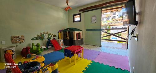 a room with a play room with toys in it at Rio Búzios Beach Hotel in Búzios