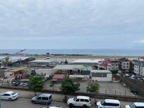 a city with cars parked in a parking lot at TRABZON ınn REZİDANS in Trabzon