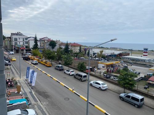a busy city street with cars parked on the road at TRABZON ınn REZİDANS in Trabzon