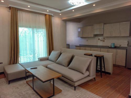 Η κουζίνα ή μικρή κουζίνα στο 19&G Apt