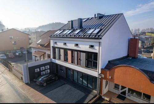 a building with solar panels on top of it at Apartamenty Parkowe in Żywiec