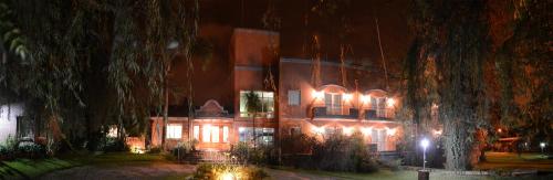 a large building with lights on it at night at Don Numas Posada & Spa in San Lorenzo