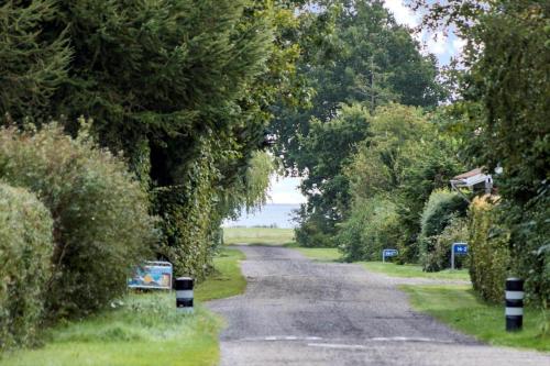 a road with trees on the side of it at 30178-Odder-Chr-Christensensvej-9 in Beder