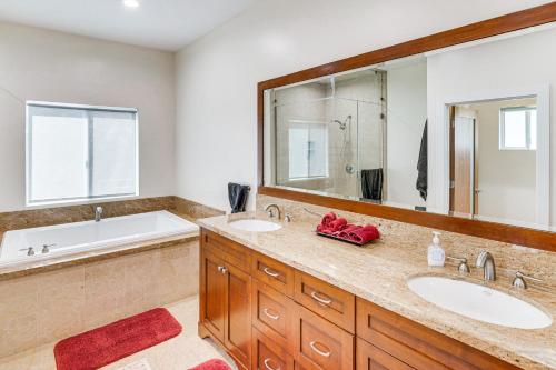 a bathroom with two sinks and a large mirror at WFH Friendly Spacious Hillside Retreat in Encino in Encino