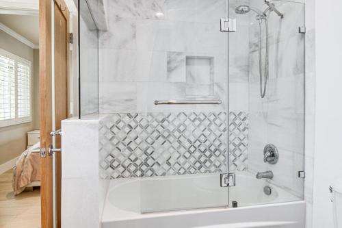 a bathroom with a shower with a glass door at WFH Friendly Spacious Hillside Retreat in Encino in Encino