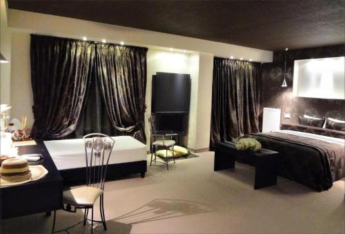 Postel nebo postele na pokoji v ubytování Prytaneio Design Hotel