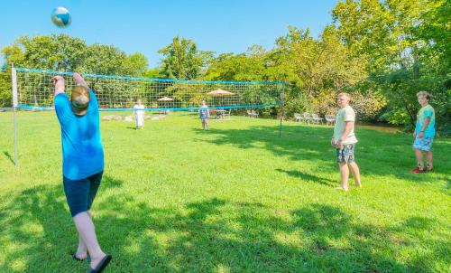 a group of children playing soccer in a field at Arbors at Island Landing Hotel & Suites in Pigeon Forge