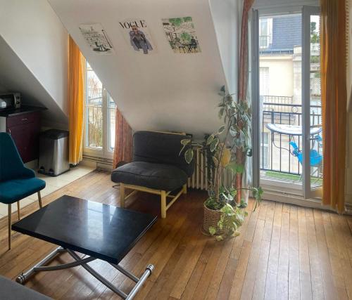 Χώρος καθιστικού στο Appartement Paris 16e Passy Tour Eiffel