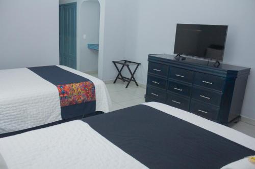 Postel nebo postele na pokoji v ubytování Nk Hotel Nekié Tepic