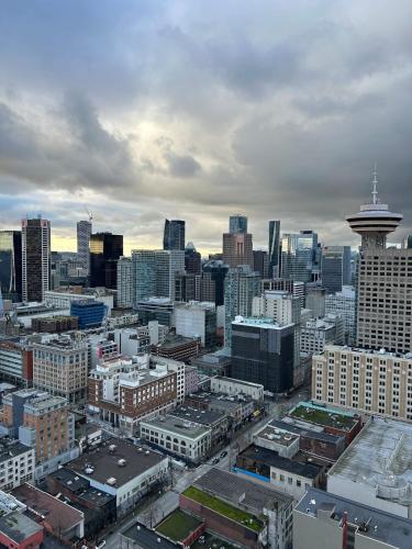a view of a large city with a stratosphere at Cozy Gastown condo with a view! in Vancouver