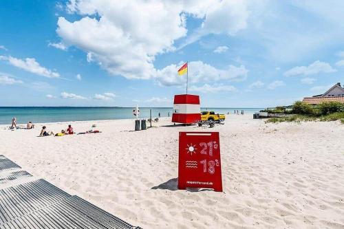 a sign in the sand on a beach at 30476-Odder-Hulager-9 in Odder