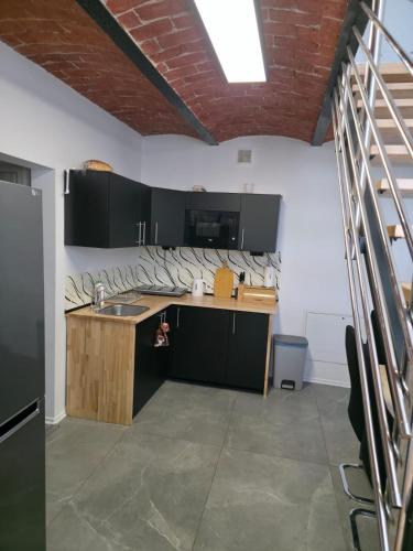 a kitchen with a sink and a counter top at Pyrzowice noclegi AirNest 8 min od Lotniska Katowice Airport 