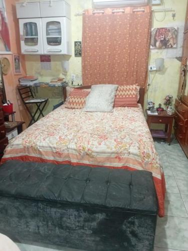 a bedroom with a large bed in a room at Casa Solar da Lua COP30 in Belém