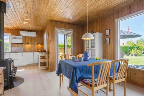 a kitchen and dining room with a table and chairs at 30020-Malling-Hyldevaenget-17 in Malling