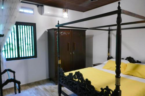 Katil atau katil-katil dalam bilik di Paddy Greens Villa Unawatuna