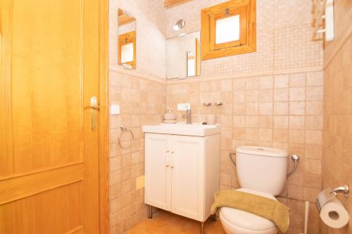 a bathroom with a toilet and a sink and a mirror at 113 Finca Can Roig ETV955 by Mallorca Charme in Alcudia