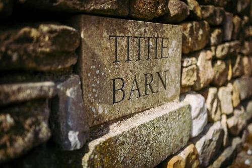 a stone sign that reads the little barun on a stone wall at Tithe Barn, Skipton in Skipton