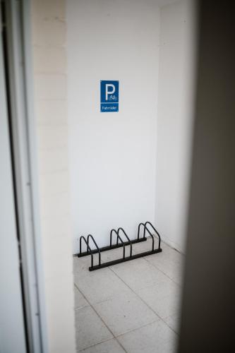 a row of metal rails on a wall at Exklusive Ferienwohnung mit Privatterrasse in Plön