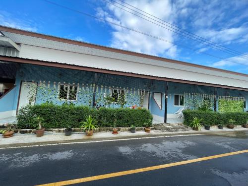a building with plants on the side of it at Yada House s&s in Nai Yang Beach