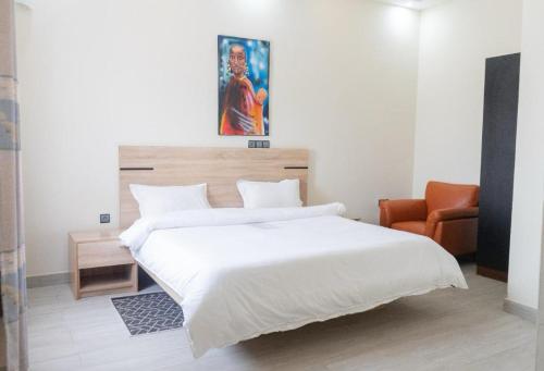 Postel nebo postele na pokoji v ubytování Hôtel SAPY
