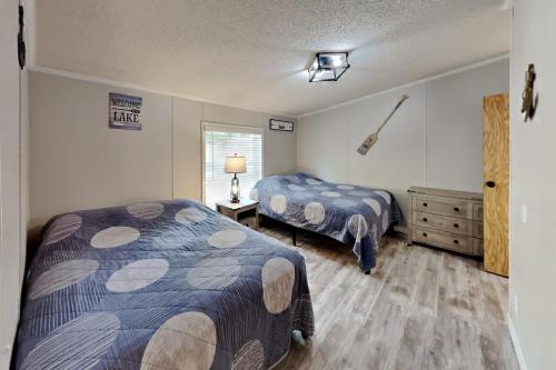 Postel nebo postele na pokoji v ubytování Island Club #106