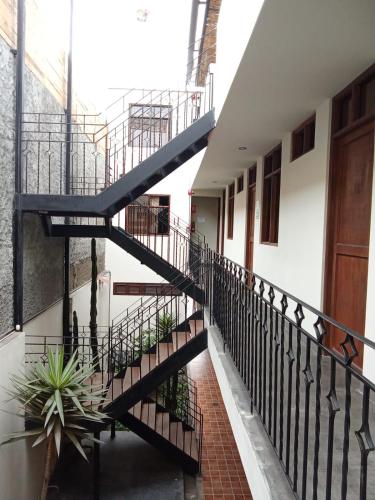 a staircase leading to the second floor of a building at China Chancay Hotel in Chancay