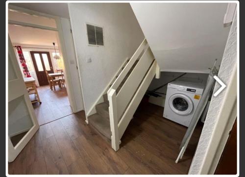 a staircase with a washing machine in a room at Newcastle No 30 Stay for Contractors, Families & Professionals in Heaton