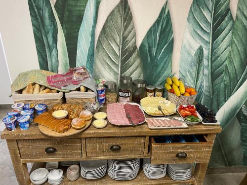 a table with food on top of it at Libušina Villa in Kutná Hora