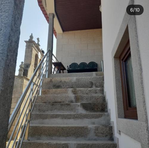a set of stairs leading to a church at Casa de l' Eigreija 