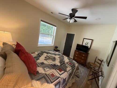 a bedroom with a bed and a ceiling fan at Solomon’s Seal - Full Home in Spruce Pine