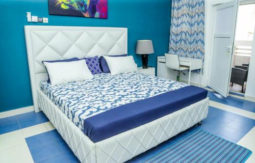 Llit o llits en una habitació de Luxensuites