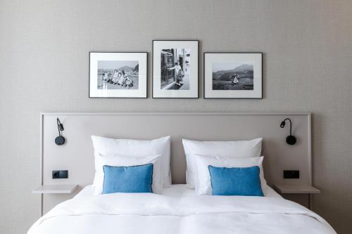 Postel nebo postele na pokoji v ubytování Hotel Vier Jahreszeiten Salzburg