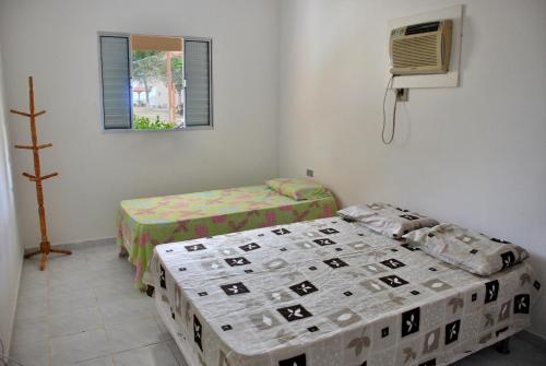 Katil atau katil-katil dalam bilik di Privê Areias Douradas