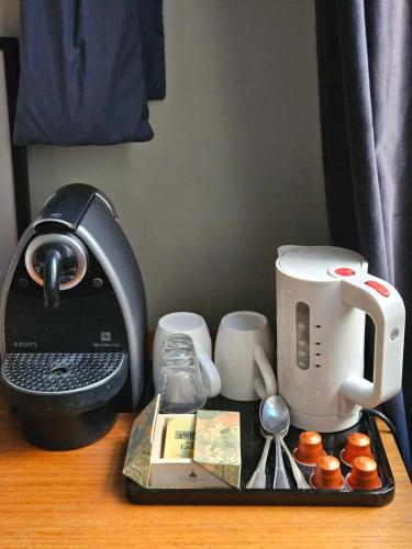 a counter top with a coffee maker and a mixer at Suite privée Terreaux in Lyon