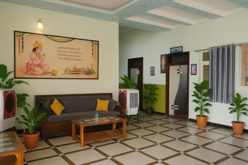 a living room with a couch and a table at Siya Resort Ayodhya - Comfortable Rooms & Luxury Stay Near Ram Mandir in Ayodhya