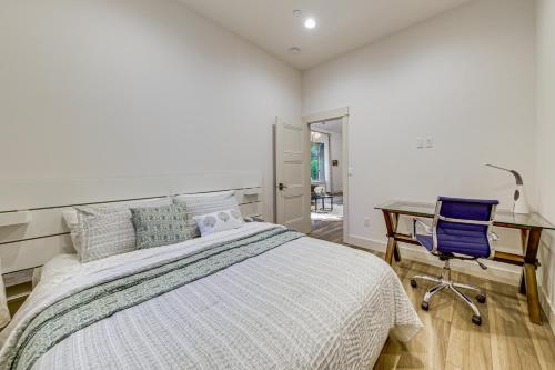 a bedroom with a bed and a desk and a chair at WFH-Friendly Gem with Creek 4 Mi to Sammamish Trail in Redmond