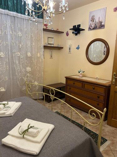 a room with a table with a mirror and a dresser at L' Antica Sosta in Abbadia San Salvatore