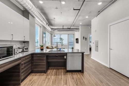 a kitchen with a sink and a counter top at City Vibes 2BR Walk Everywhere in DWNTN St. Pete in St. Petersburg