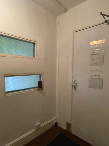 a room with a door and a window at Bryn Awel in Aberystwyth