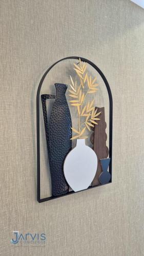 a framed picture of two vases and a vase at Dusit Grand Park - Modern Studio Pool View in Jomtien Beach