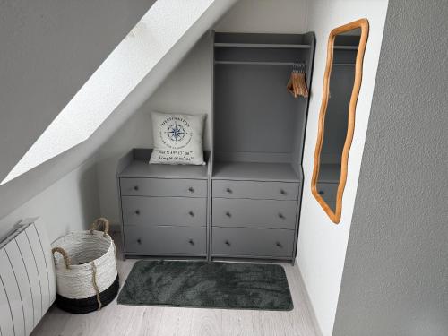 a bedroom with a dresser in a attic at L'ALOUETTE maison 4/5pers PISCINE/MER Cabourg à pied in Dives-sur-Mer