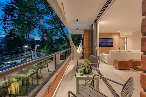 an apartment balcony with a view of a living room at Tivoli 202 - Escapada Premium con Jacuzzi Privado in El Poblado