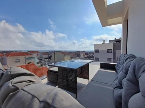 a balcony with a view of a swimming pool at Mirante Monte e Mar in Esposende